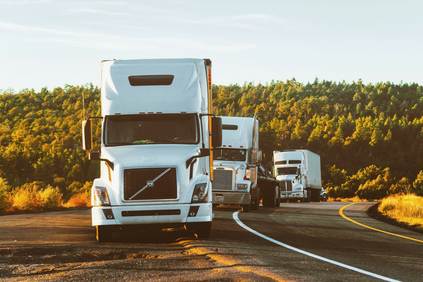Diesel semi truck fleet parked in a commercial yard in Alberta
